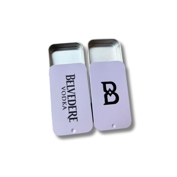 Two Belvedere Vodka-branded metal containers, one featuring the full 'Belvedere Vodka' logo and the other displaying the 'B' monogram in black.