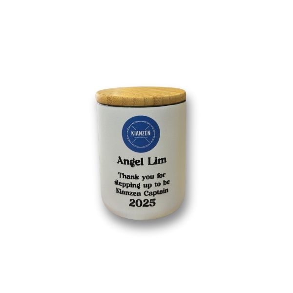 Ceramic jar with a bamboo lid, featuring the 'Kianzen' logo and a personalized message: 'Angel Lim, Thank you for stepping up to be Kianzen Captain 2025.
