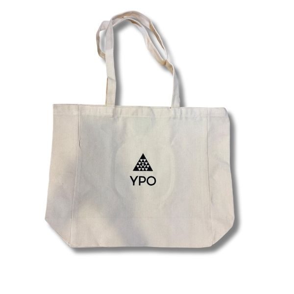 White canvas tote bag with the YPO logo, featuring a triangular pattern above the letters YPO.
